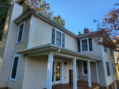 Light-colored residential home with clean siding and trim